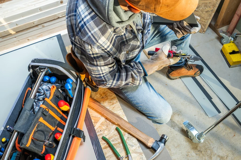 Professional selecting tools from a toolbox for property maintenance work