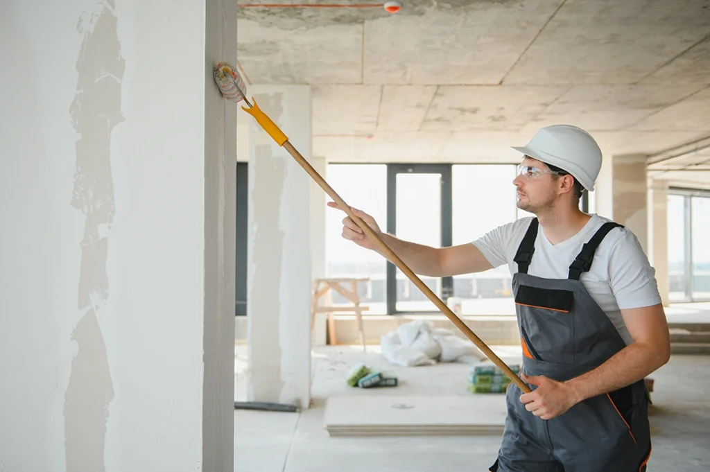 a professional painting a wall in auckland