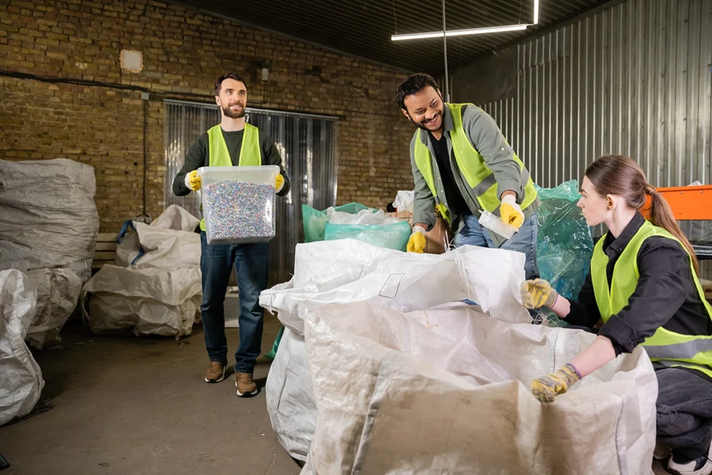 Maintenance team collecting household and construction waste from a property